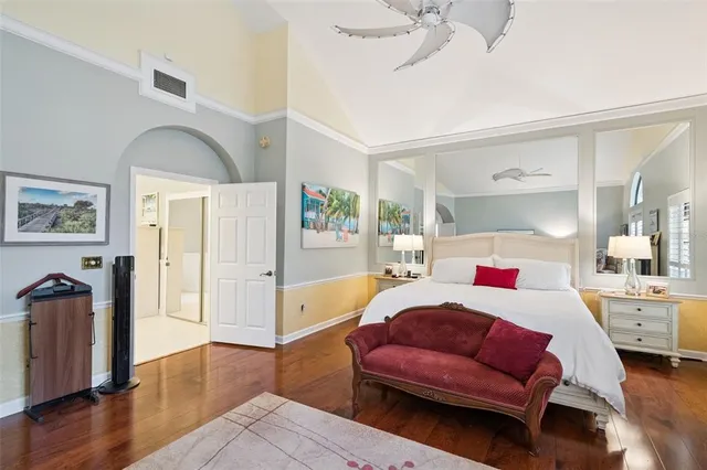 a spacious en suite bathroom with a double vanity sink and a mirror