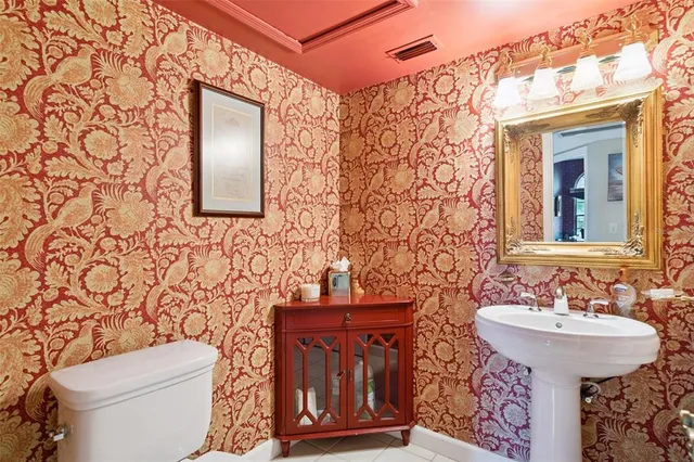 a bed room with a bed window and a chair