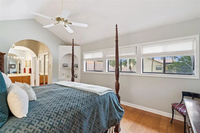 a spacious bathroom with a sink mirror and vanity