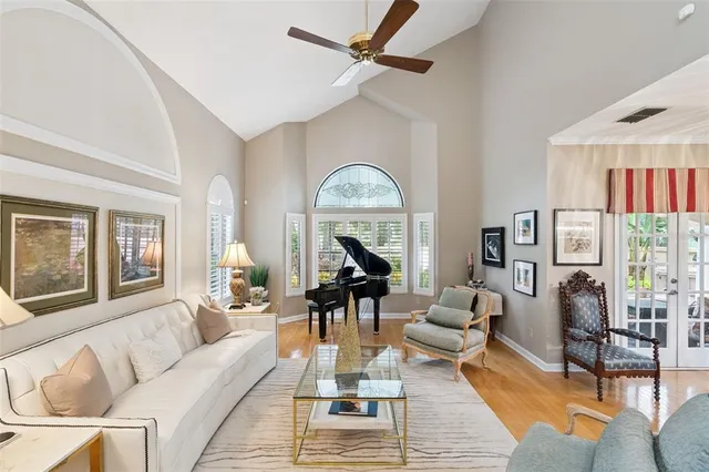 a living room with fireplace furniture and a wooden floor