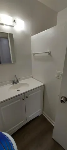 a bathroom with a sink and mirror