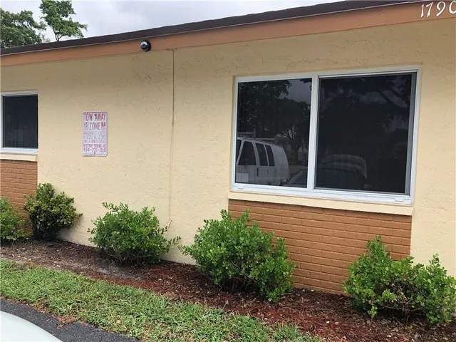 a view of a house with a small yard