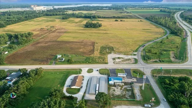 an aerial view of a house with outdoor space swimming pool