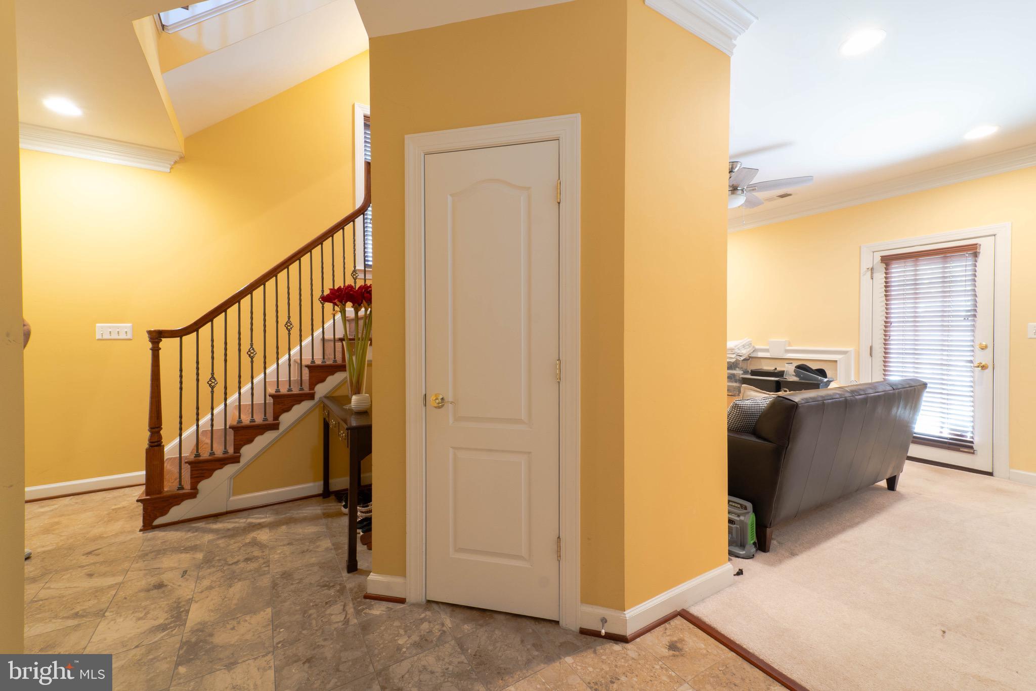 11453 Galliec Street, Unit 40 Fairfax, VA 22030 - Photo 12 of 45 a view of a hallway with wooden floor and staircase