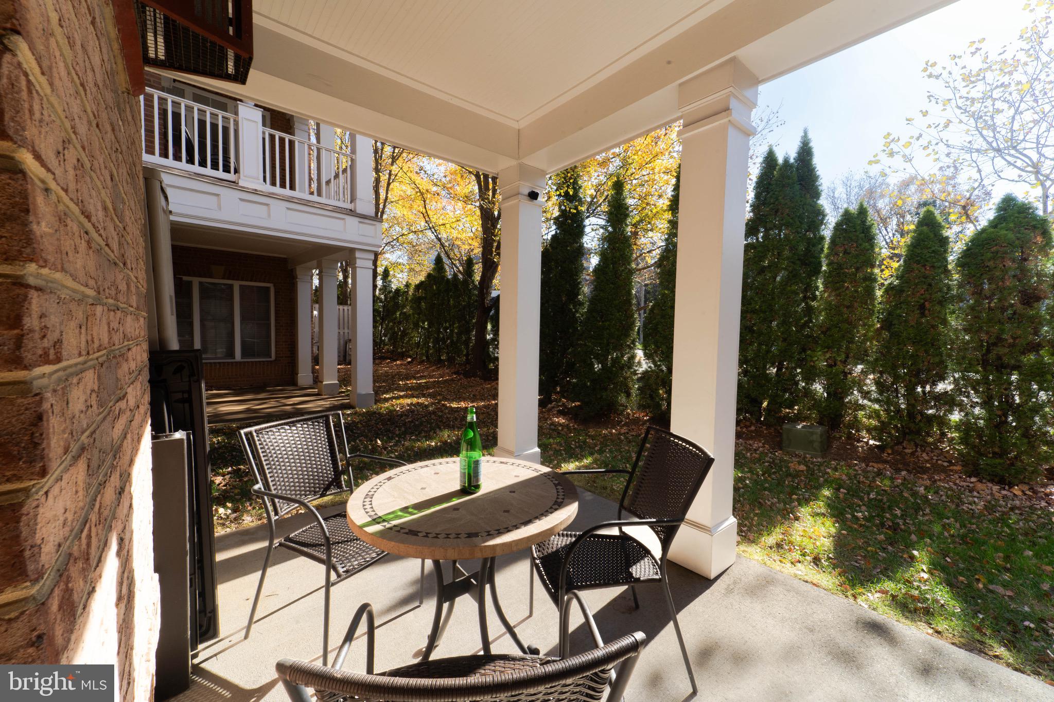 11453 Galliec Street, Unit 40 Fairfax, VA 22030 - Photo 13 of 45 a view of balcony with a patio and outdoor seating
