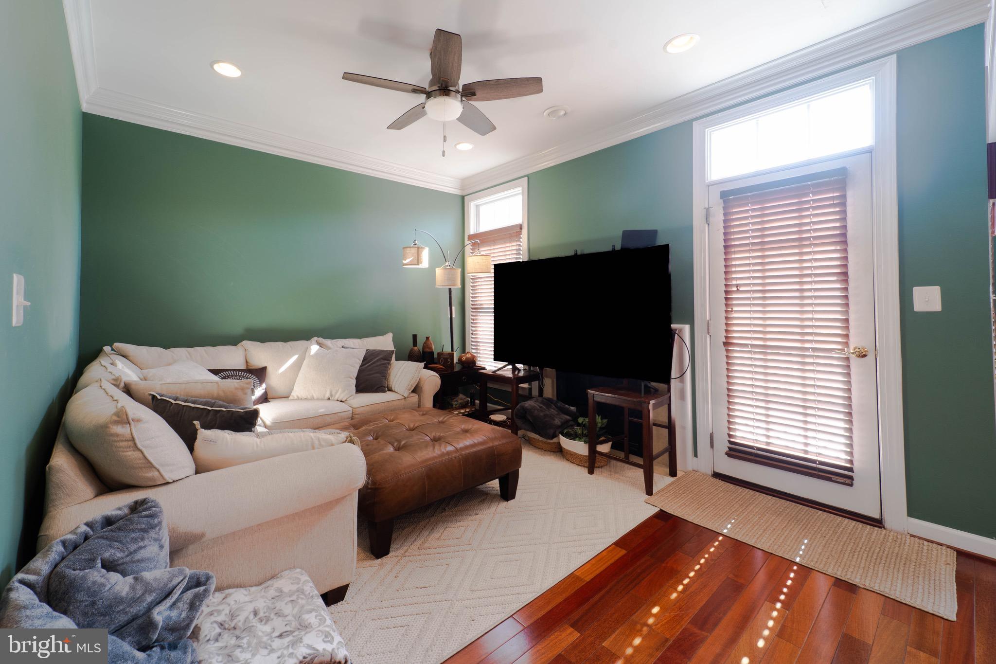 11453 Galliec Street, Unit 40 Fairfax, VA 22030 - Photo 20 of 45 a living room with furniture and a flat screen tv