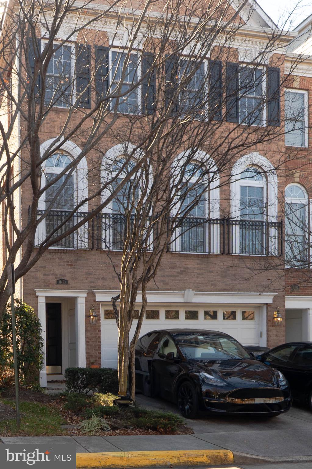 11453 Galliec Street, Unit 40 Fairfax, VA 22030 - Photo 2 of 45 a car parked in front of a building