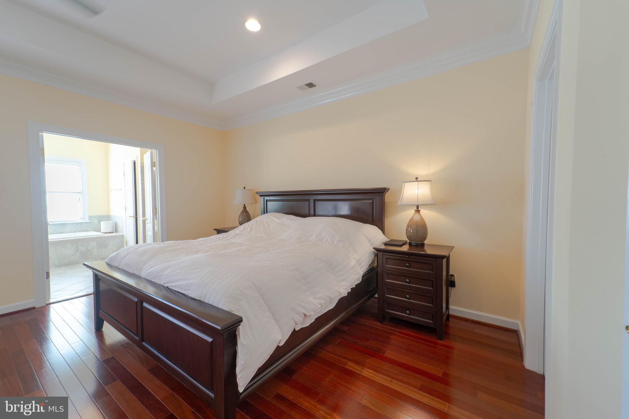 11453 Galliec Street, Unit 40 Fairfax, VA 22030 - Photo 29 of 45 a bed sitting in a spacious bedroom next to a window
