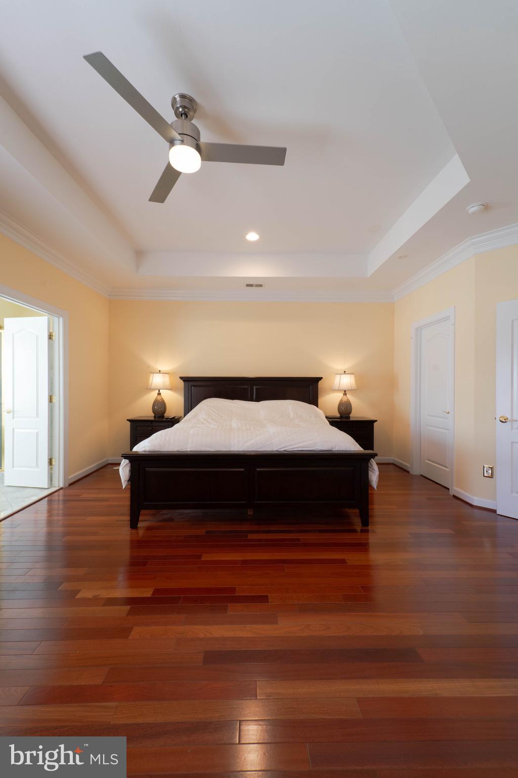 11453 Galliec Street, Unit 40 Fairfax, VA 22030 - Photo 30 of 45 a bedroom with a bed and wooden floor