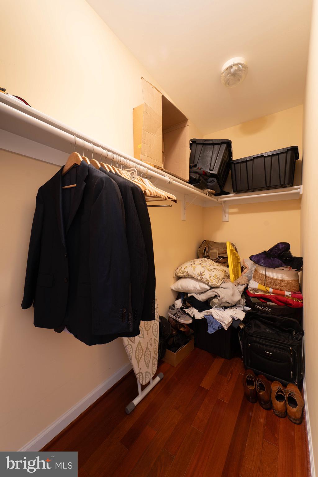 11453 Galliec Street, Unit 40 Fairfax, VA 22030 - Photo 32 of 45 a view of walk in closet with clothes and shoes