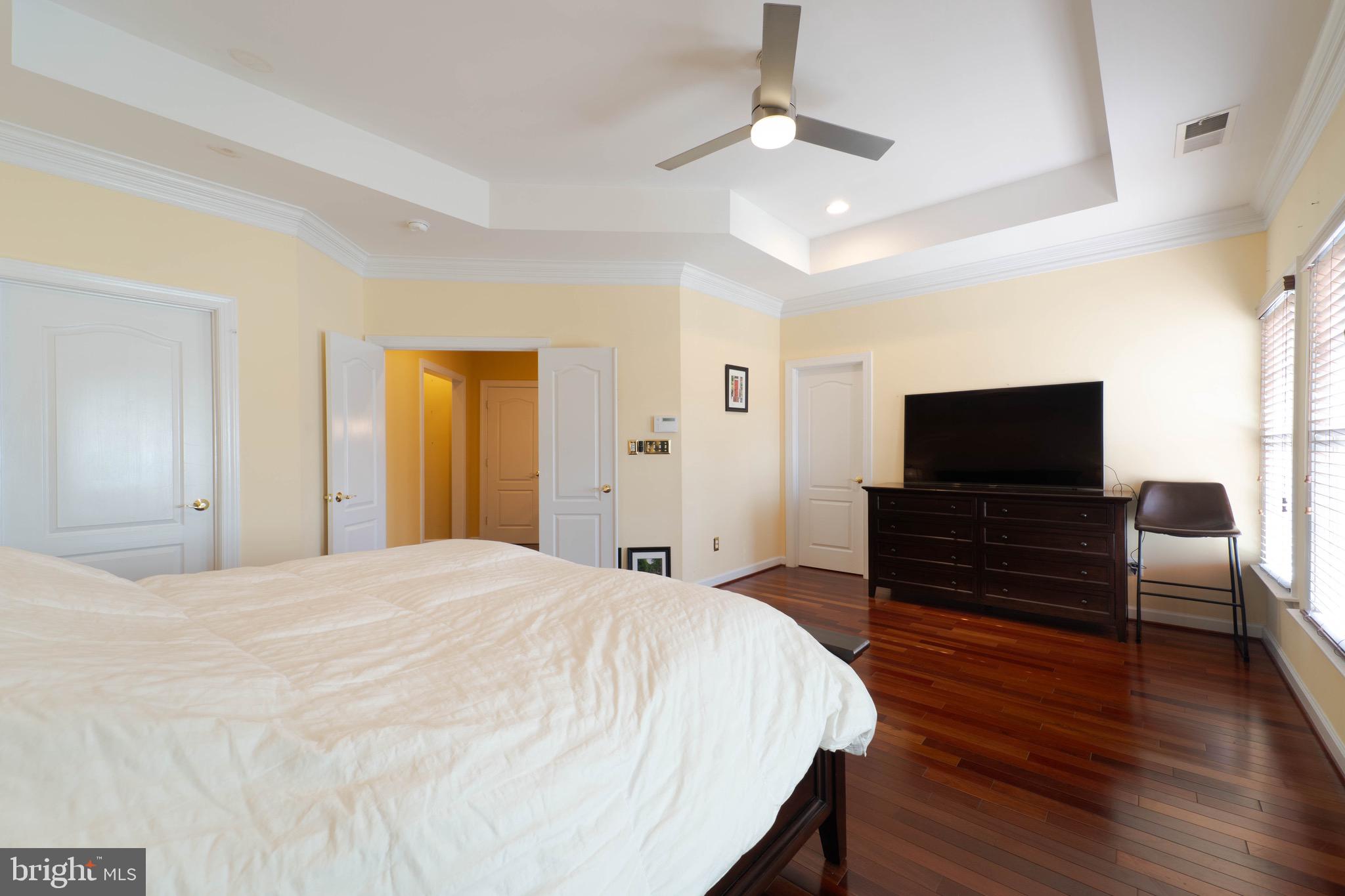 11453 Galliec Street, Unit 40 Fairfax, VA 22030 - Photo 34 of 45 a bedroom with furniture and flat screen tv