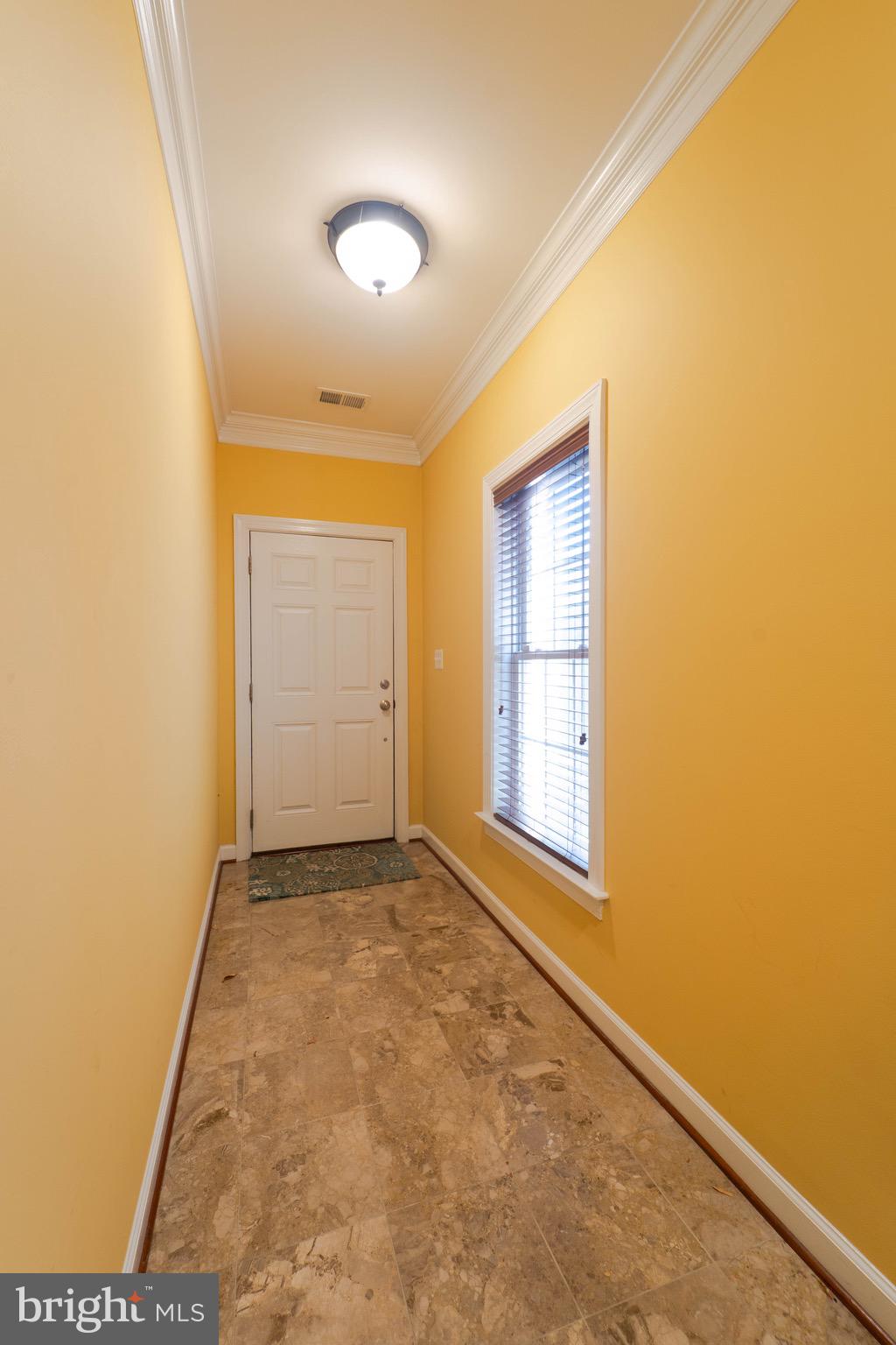 11453 Galliec Street, Unit 40 Fairfax, VA 22030 - Photo 4 of 45 an empty room with windows