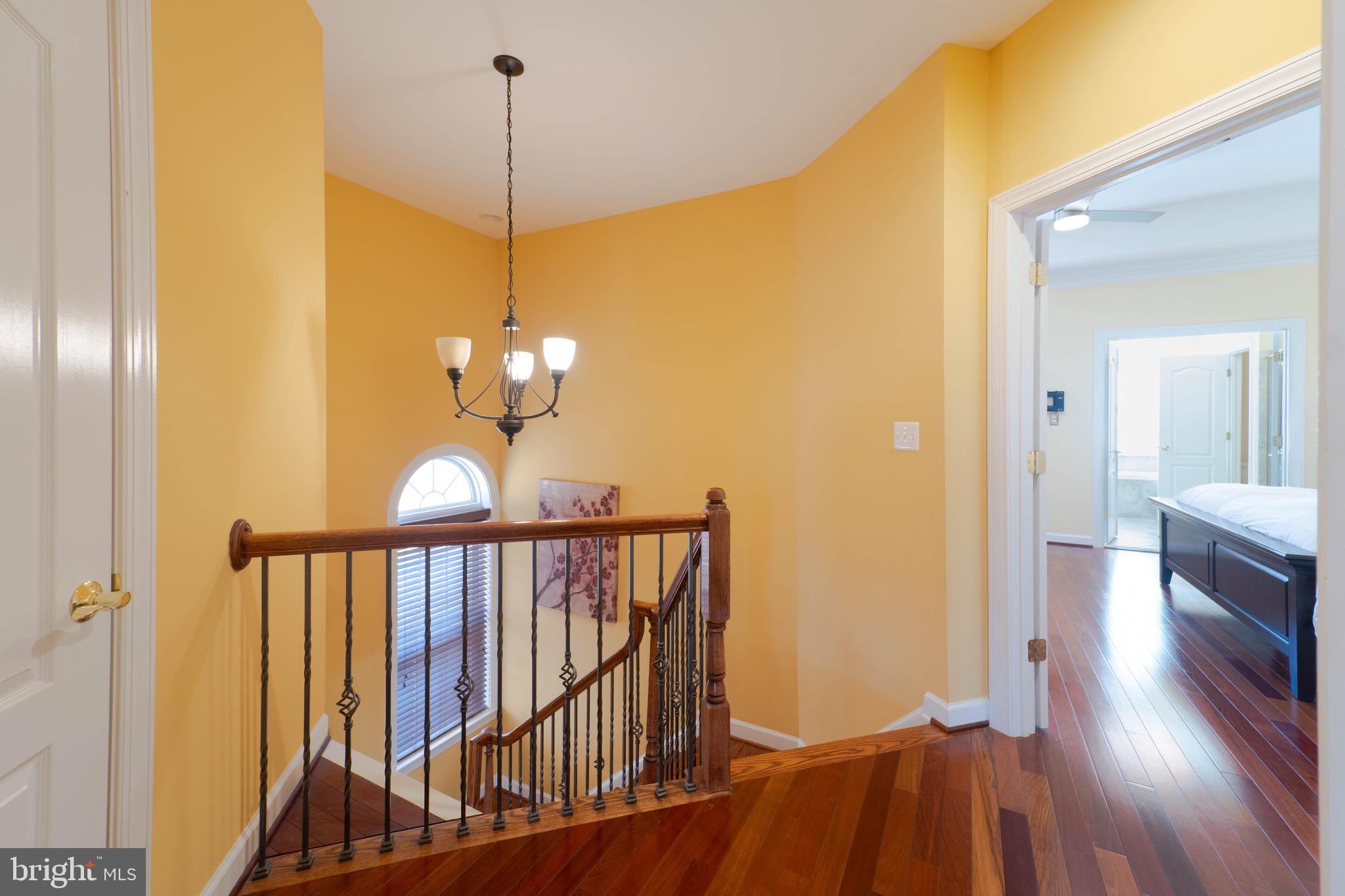 11453 Galliec Street, Unit 40 Fairfax, VA 22030 - Photo 42 of 45 a view of a hallway with wooden floor and staircase
