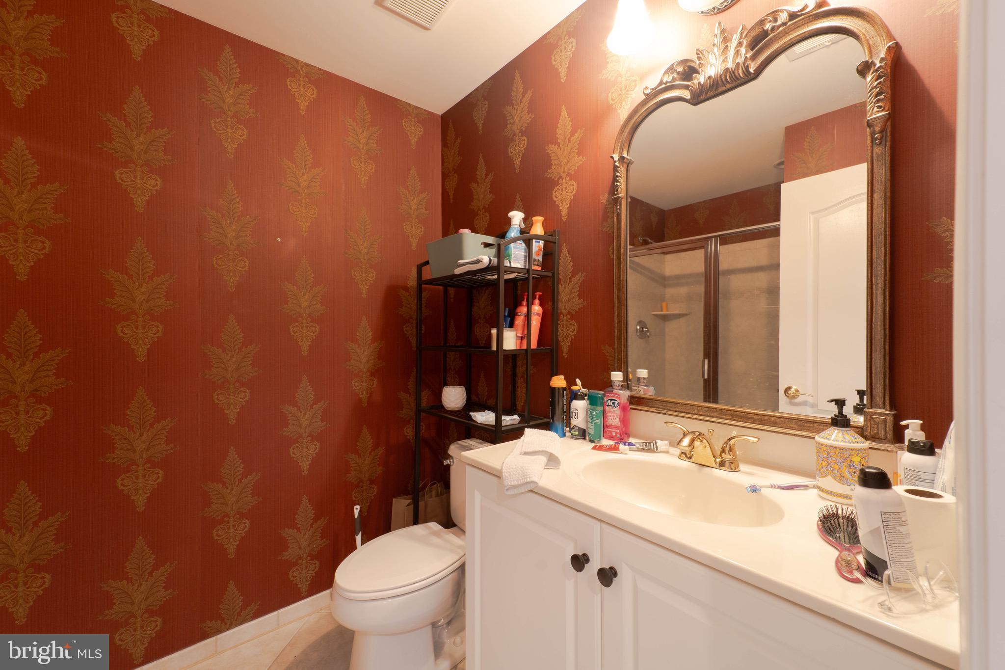 11453 Galliec Street, Unit 40 Fairfax, VA 22030 - Photo 9 of 45 a bathroom with a sink and a mirror