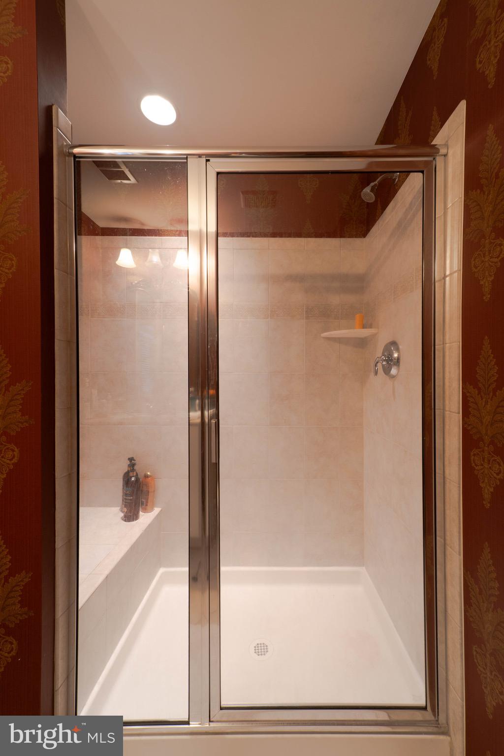 11453 Galliec Street, Unit 40 Fairfax, VA 22030 - Photo 10 of 45 a bathroom with a glass shower door