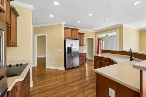 a view of kitchen with cabinets and wooden floor