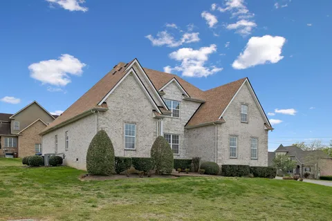 a view of a house with a big yard