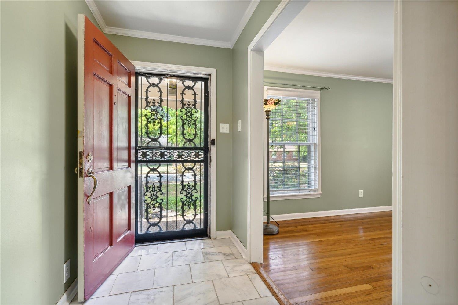 416 Fleda Road Memphis, TN 38120 - Photo 4 of 32 Foyer entrance with light tile patterned floors and ornamental molding