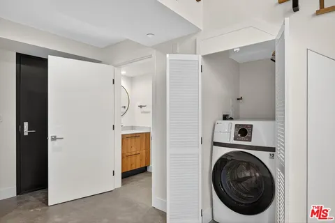a view of a storage & utility room with washer and dryer