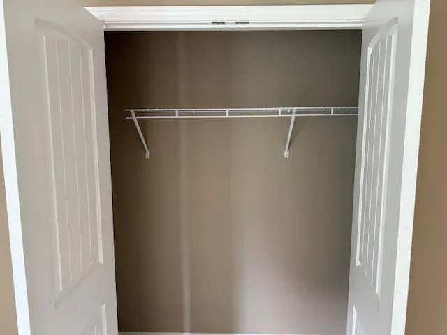 a view of a room with rack on the wall