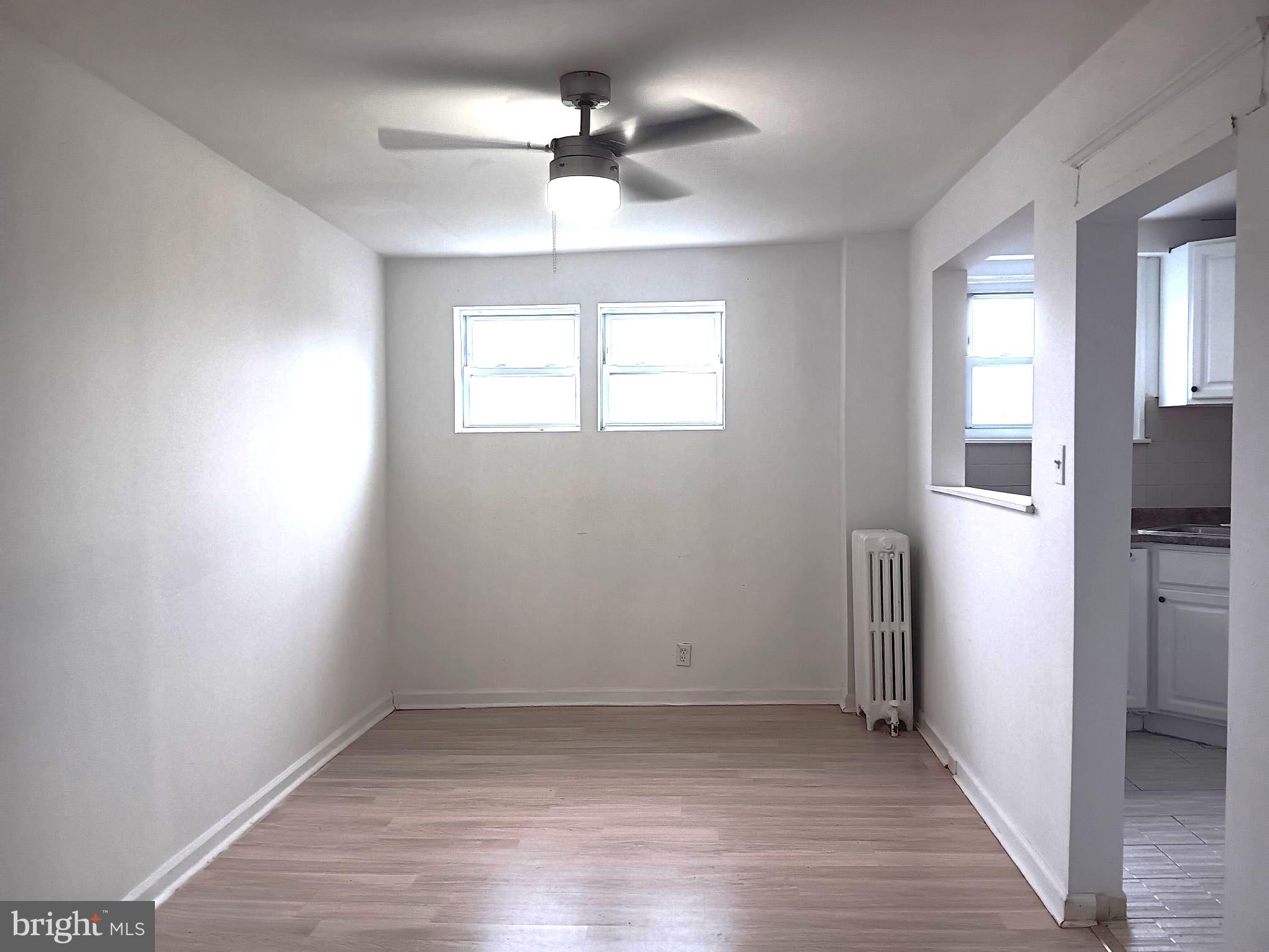 1815 Penfield Street Philadelphia, PA 19126 - Photo 3 of 11 wooden floor in an empty room with a window