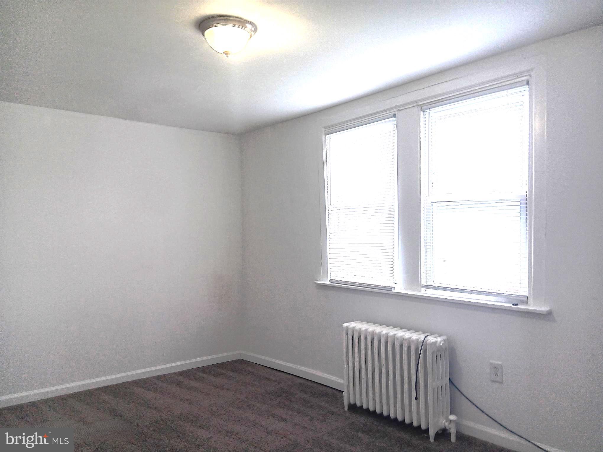 1815 Penfield Street Philadelphia, PA 19126 - Photo 7 of 11 an empty room with a window