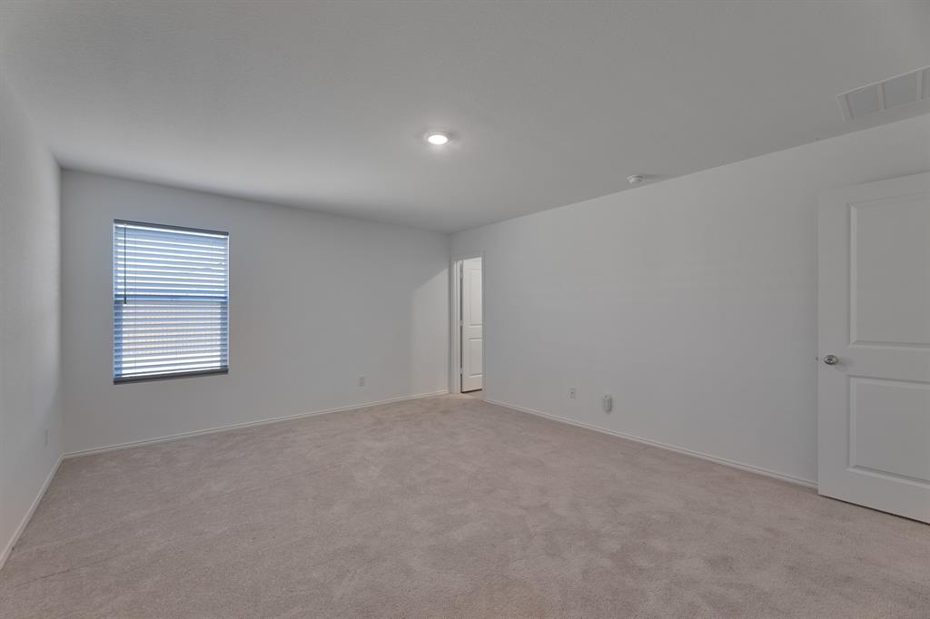 9752 Platteview Road Fort Worth, TX 76179 - Photo 18 of 25 a view of an empty room with a window