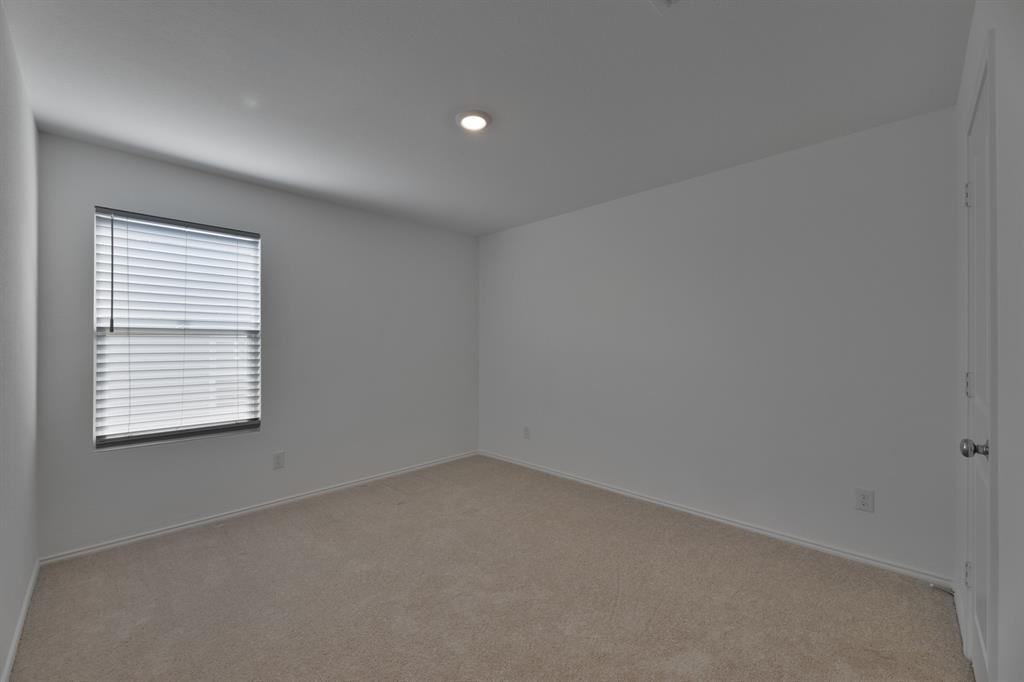 9752 Platteview Road Fort Worth, TX 76179 - Photo 21 of 25 an empty room with a window