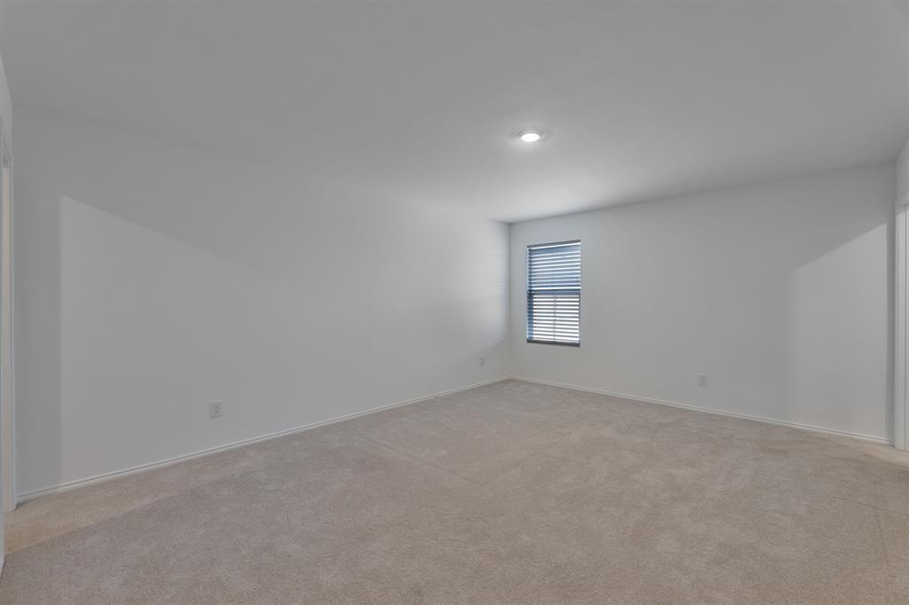 9752 Platteview Road Fort Worth, TX 76179 - Photo 4 of 25 an empty room with a window