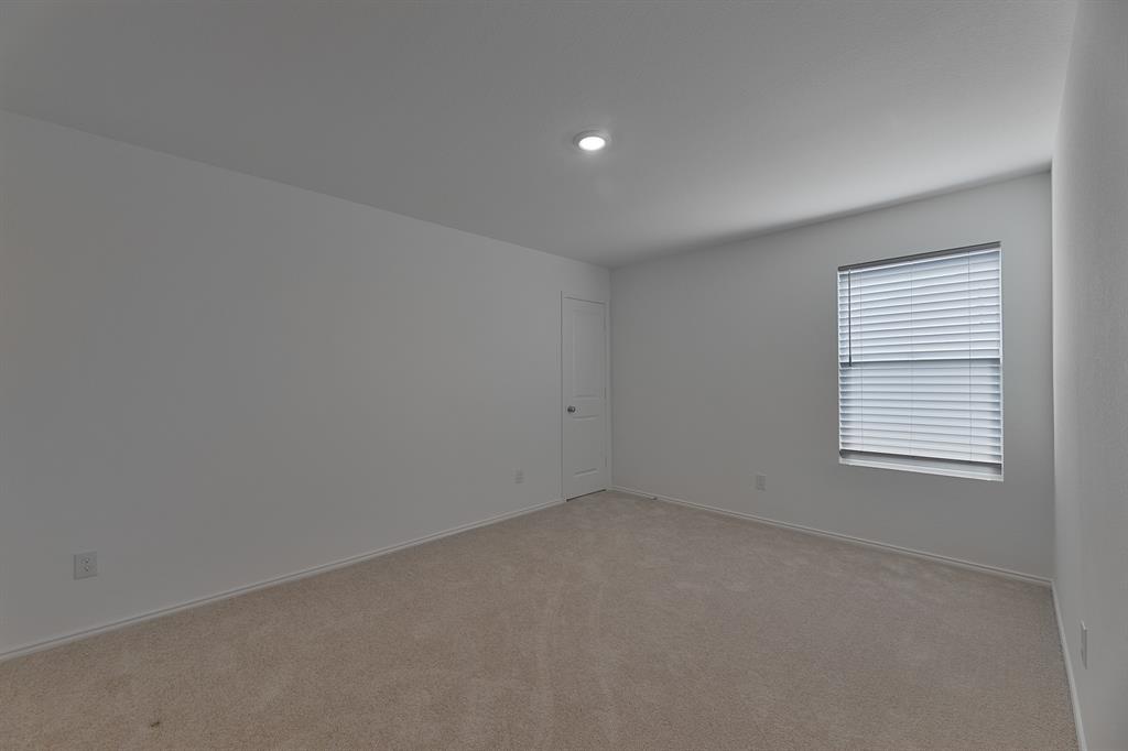 9752 Platteview Road Fort Worth, TX 76179 - Photo 5 of 25 an empty room with a window