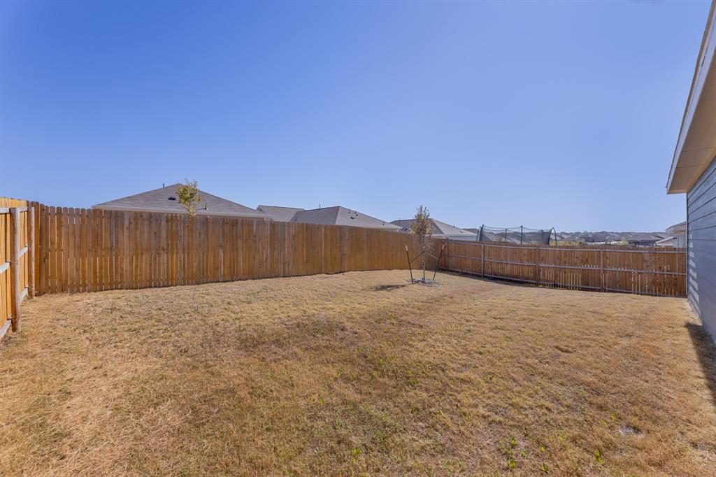9752 Platteview Road Fort Worth, TX 76179 - Photo 6 of 25 a view of an outdoor space and a fence