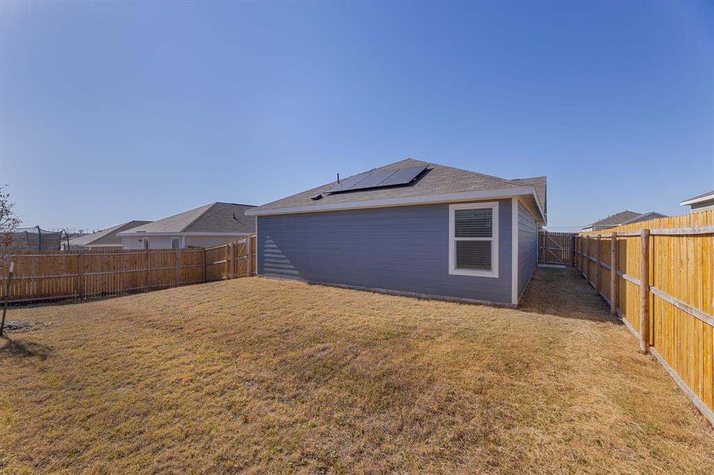 9752 Platteview Road Fort Worth, TX 76179 - Photo 7 of 25 a front view of a house with a yard