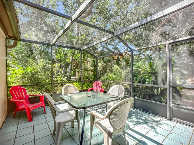 a outdoor dining space with furniture and outdoor view