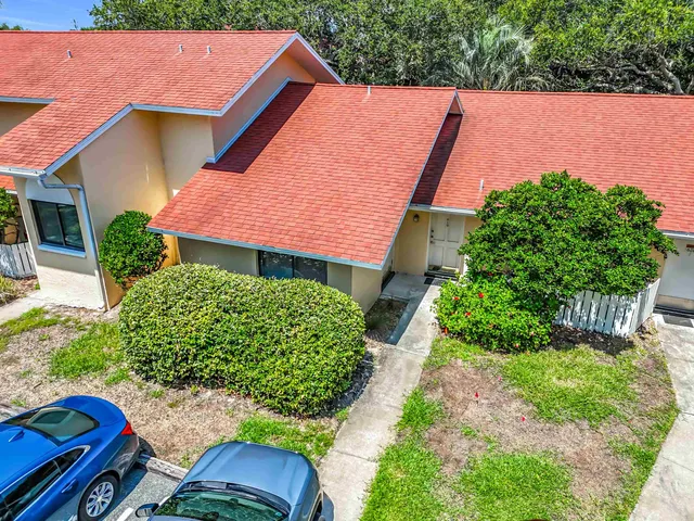 a view of backyard with outdoor seating and green space