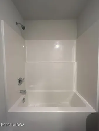a close up of a bathtub in a bathroom