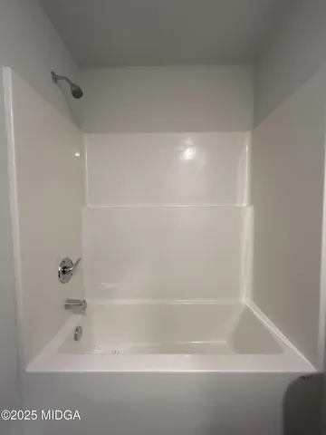 a close up of a bathtub in a bathroom
