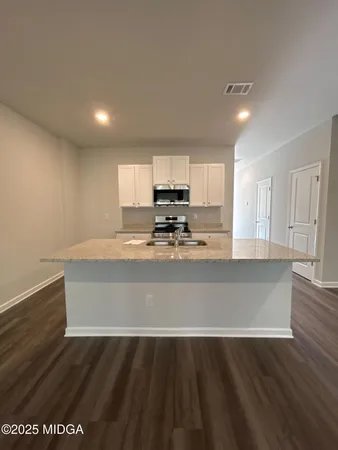 a view of kitchen with wooden floor