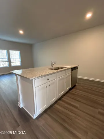 a kitchen with a sink and cabinets