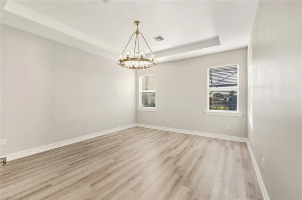a kitchen with stainless steel appliances kitchen island granite countertop a stove a sink and a microwave