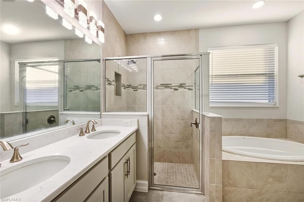 28049 Captiva Shell Loop Bonita Springs, FL 34135 - Photo 19 of 50 a bathroom with a double vanity sink mirror and shower