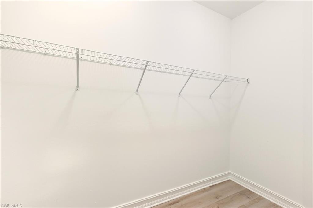 28049 Captiva Shell Loop Bonita Springs, FL 34135 - Photo 20 of 50 a view of a room with racks on the wall