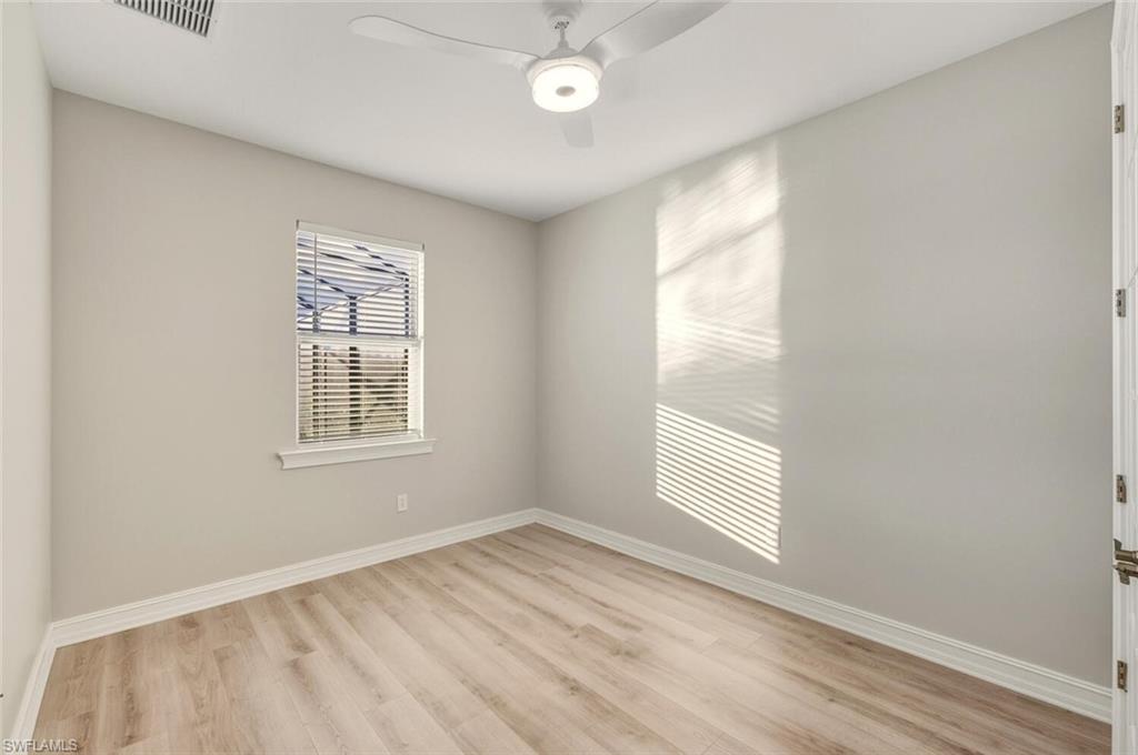28049 Captiva Shell Loop Bonita Springs, FL 34135 - Photo 21 of 50 an empty room with windows and closet