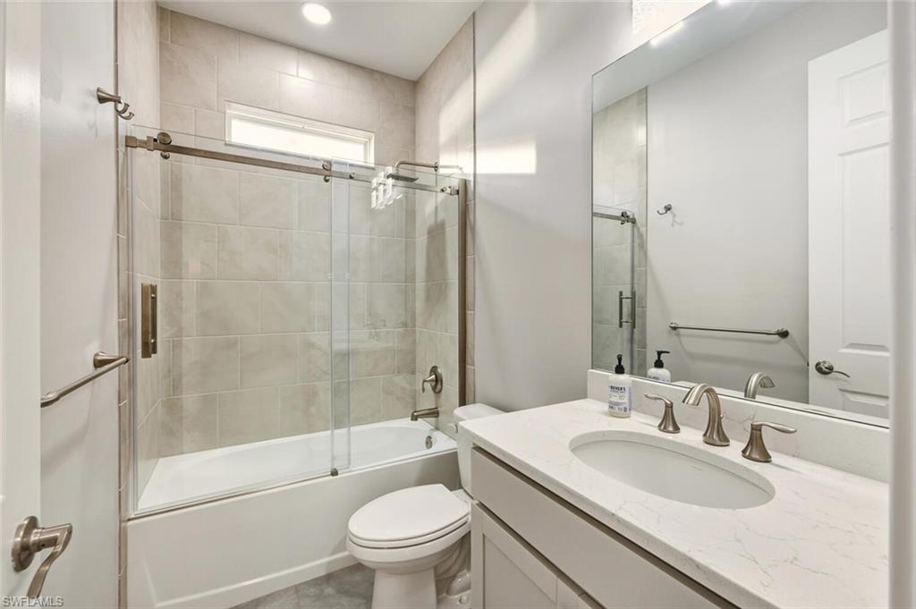 28049 Captiva Shell Loop Bonita Springs, FL 34135 - Photo 23 of 50 a bathroom with a sink toilet and shower