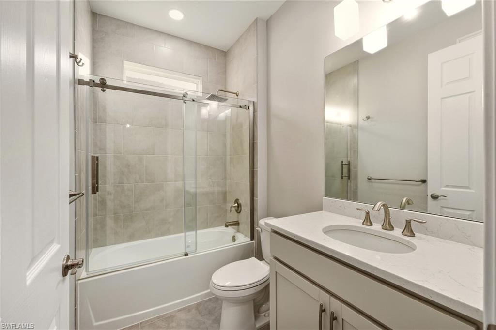 28049 Captiva Shell Loop Bonita Springs, FL 34135 - Photo 28 of 50 a bathroom with a sink toilet and shower