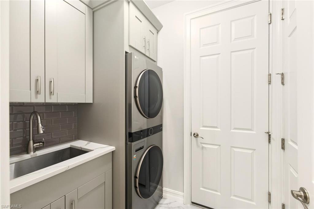 28049 Captiva Shell Loop Bonita Springs, FL 34135 - Photo 29 of 50 a utility room with dryer and washer