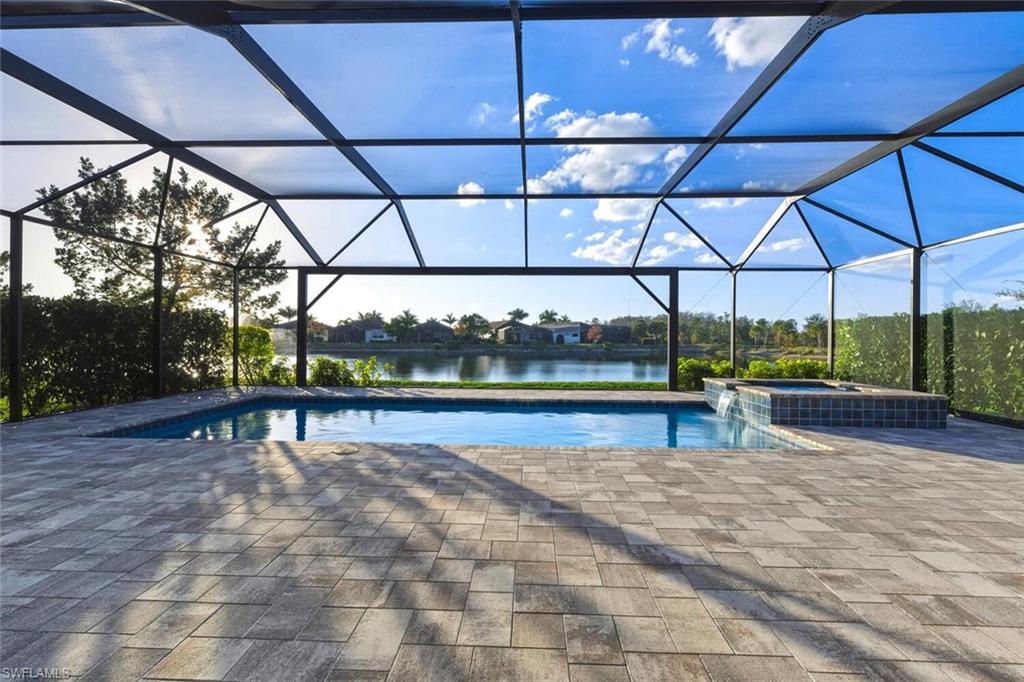 28049 Captiva Shell Loop Bonita Springs, FL 34135 - Photo 33 of 50 a view of a swimming pool with a porch