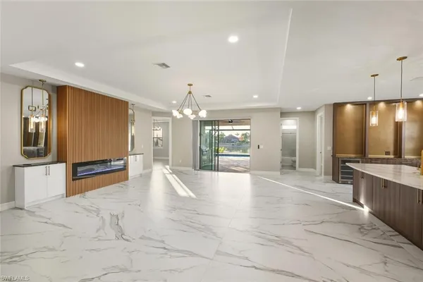 a large kitchen with a large counter top appliances and cabinets