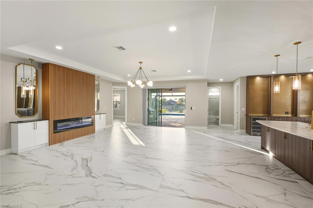 28049 Captiva Shell Loop Bonita Springs, FL 34135 - Photo 4 of 50 a large kitchen with a large counter top appliances and cabinets