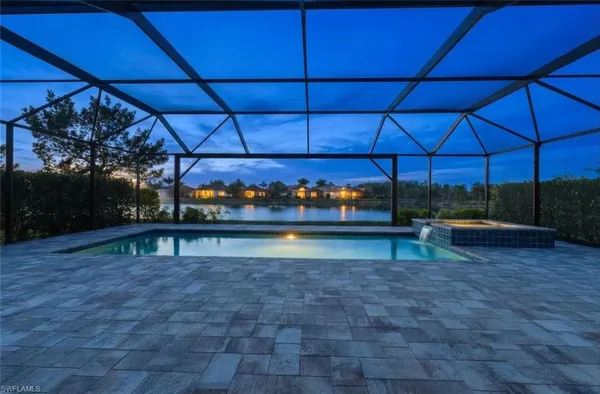 a view of a swimming pool with a patio