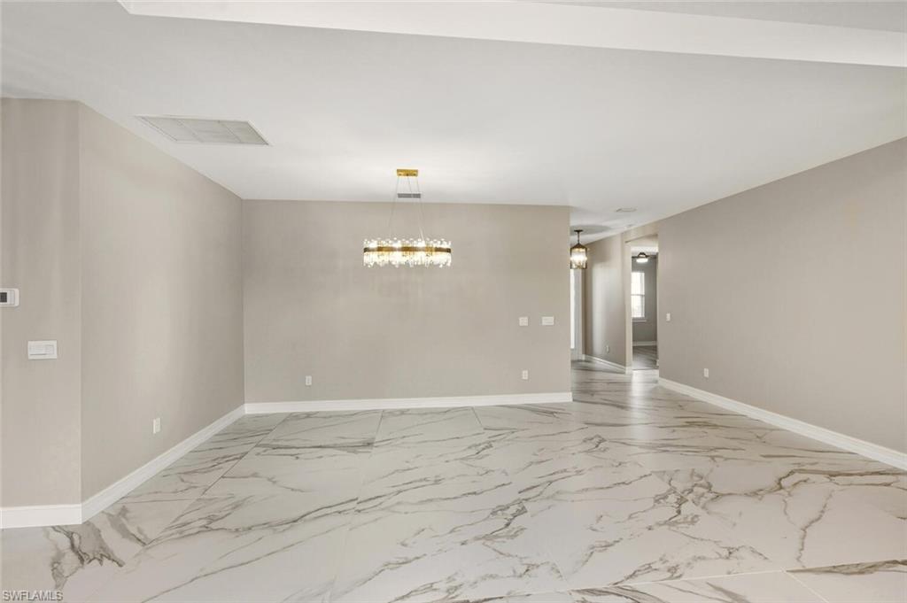 28049 Captiva Shell Loop Bonita Springs, FL 34135 - Photo 7 of 50 wooden floor in an empty room